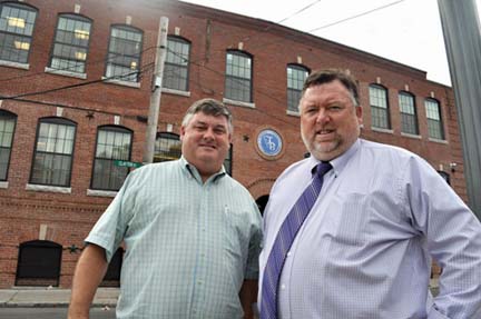 Greg and Brendan Feeney: Entrepreneurs have built a thiving utility excavation business from their base in Dorchester. Above, the brothers are shown outside their newly renovated headquarters on Clayton Street. Photo by Bill Forry